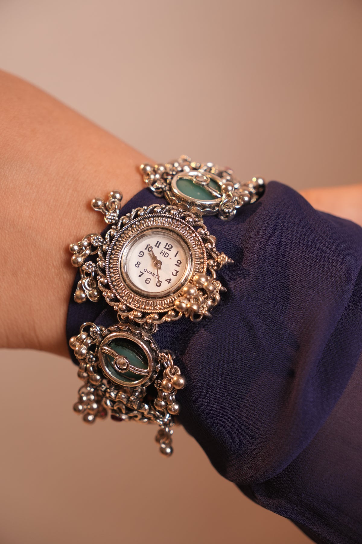 Silver Navratri Watch with Ethnic elements and Green Stone