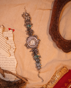 Silver Navratri Watch with Ethnic elements and Green Stone